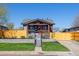 Charming home exterior boasts a landscaped front yard and inviting entrance at 15 Hazel Ct, Denver, CO 80219