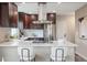 Modern kitchen with stainless steel appliances, custom cabinets, and white marble countertops at 15 Hazel Ct, Denver, CO 80219