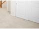 Light-filled hallway with carpeted floor and neutral walls at 2829 S Fox Ct, Englewood, CO 80110