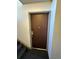 A brown door numbered 105, next to a staircase at 10211 Ura Ln # 7-108, Thornton, CO 80260