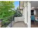 Covered balcony and a view of backyard trees at 325 S High St, Denver, CO 80209