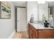 Bathroom featuring a wooden vanity, granite countertop and decorative mirror adding elegance at 325 S High St, Denver, CO 80209