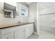 Stylish bathroom with granite countertop vanity and tiled shower/tub combination at 325 S High St, Denver, CO 80209