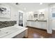 Bright bathroom featuring a soaking tub, double vanity, and elegant fixtures, offering a spa-like experience at 325 S High St, Denver, CO 80209