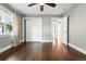 Inviting bedroom featuring hardwood floors, closet, and natural light, creating a cozy atmosphere at 325 S High St, Denver, CO 80209