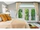 Bedroom with balcony access, French doors and bright natural light at 325 S High St, Denver, CO 80209