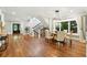 Dining room with modern light fixture leading to staircase and front door at 325 S High St, Denver, CO 80209