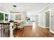 Elegant dining room featuring a modern chandelier, adjacent to a built in bar and sliding glass door at 325 S High St, Denver, CO 80209