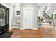 Inviting foyer with hardwood floors, a staircase, and ample natural light at 325 S High St, Denver, CO 80209