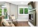 Inviting living room featuring comfortable seating, a fireplace and large windows at 325 S High St, Denver, CO 80209