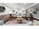 Cozy living room with stylish decor, a brick accent wall, and built in bookshelves at 325 S High St, Denver, CO 80209