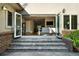 Indoor/outdoor living with bi-fold doors to a living room with recessed lighting at 325 S High St, Denver, CO 80209