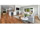 Open concept living room with fireplace, wine cooler, comfortable seating, and staircase to the upper level at 325 S High St, Denver, CO 80209