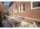 Brick home exterior with patio and space for outdoor entertaining at 2210 E Mississippi Ave # 3, Denver, CO 80210