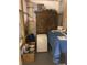 Basement storage area featuring miscellaneous stored household items and wooden shelving at 2210 E Mississippi Ave # 3, Denver, CO 80210