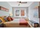 Serene bedroom offers lots of natural light with ceiling fan and neutral decor at 2210 E Mississippi Ave # 3, Denver, CO 80210