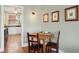 Dining area with a view into the kitchen featuring a table and chairs at 2210 E Mississippi Ave # 3, Denver, CO 80210