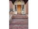 Close-up of the building's entrance, highlighting the intricate brickwork and charming details at 2210 E Mississippi Ave # 3, Denver, CO 80210
