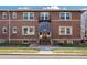 Charming brick building with a welcoming entrance and well-maintained landscaping at 2210 E Mississippi Ave # 3, Denver, CO 80210