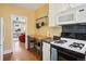 Cozy kitchen includes a gas range, granite countertops, and seamless access to the living area at 2210 E Mississippi Ave # 3, Denver, CO 80210