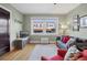Inviting living room with a comfortable seating area and a large window overlooking the street at 2210 E Mississippi Ave # 3, Denver, CO 80210