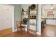 Office nook featuring hardwood floors, neutral walls, and ample natural light at 2210 E Mississippi Ave # 3, Denver, CO 80210