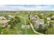 Aerial view of greenbelt between neighborhood homes with drainage, walking path and open green space at 14713 Josephine St, Thornton, CO 80602