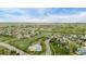 An aerial view of the community showing the swimming pool and residential area in a neighborhood at 14713 Josephine St, Thornton, CO 80602