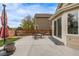 Backyard concrete patio with comfortable seating and a patio umbrella, perfect for outdoor relaxation and entertaining at 14713 Josephine St, Thornton, CO 80602