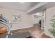 Basement gym area with laminate floors, weights, and a treadmill, offers a bright dedicated space for fitness at 14713 Josephine St, Thornton, CO 80602