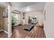 A basement gym offers a bright, dedicated space for fitness with laminate floors, weights, and a mirror at 14713 Josephine St, Thornton, CO 80602