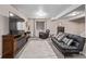 Spacious basement with plush carpeting, a large TV, and comfortable seating is the perfect entertainment space at 14713 Josephine St, Thornton, CO 80602