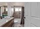 Charming bathroom features a shower-tub combination and a stylish single sink vanity with a light countertop at 14713 Josephine St, Thornton, CO 80602