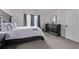 This bedroom boasts carpet flooring, modern curtains, a sizable bed, and large window at 14713 Josephine St, Thornton, CO 80602