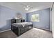 This secondary bedroom features light blue walls, closet space, and gray carpet at 14713 Josephine St, Thornton, CO 80602