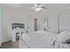 Bright bedroom featuring an expansive bed, closet, vanity, and white color palette at 14713 Josephine St, Thornton, CO 80602