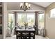 Bright dining area with large windows and sliding door, perfect for Gathering meals and gatherings at 14713 Josephine St, Thornton, CO 80602