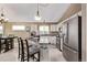 Well-equipped kitchen with granite countertops, stainless steel appliances, and a kitchen island at 14713 Josephine St, Thornton, CO 80602