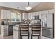 Modern kitchen with stainless steel appliances, stylish backsplash, and a functional center island at 14713 Josephine St, Thornton, CO 80602