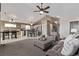 Comfortable living space with plush seating, seamlessly connecting the kitchen and dining areas at 14713 Josephine St, Thornton, CO 80602