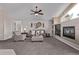 Relaxing living room with a fireplace, built-in shelves and comfortable furnishings at 14713 Josephine St, Thornton, CO 80602