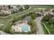 Community swimming pool with recreation center surrounded by green spaces in residential neighborhood at 14713 Josephine St, Thornton, CO 80602