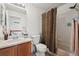 Well-maintained bathroom with a shower, toilet, and a vanity with sink offering functionality and style at 4056 Perth St, Denver, CO 80249