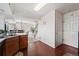Bright and spacious kitchen with stainless steel appliances and views leading to the dining room and staircase at 4056 Perth St, Denver, CO 80249