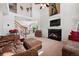 Bright living room features a fireplace, plush furnishings, and large windows with great natural light at 4056 Perth St, Denver, CO 80249