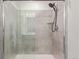 Modern bathroom boasts a glass-enclosed shower with gray tile and a sleek shower head at 1918 W 165Th Way, Broomfield, CO 80023