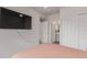 Bright bedroom with mounted TV, showing access to closet and ensuite bathroom at 1918 W 165Th Way, Broomfield, CO 80023