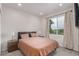 Comfortable bedroom with a large window offering scenic views and a comfortable queen bed at 1918 W 165Th Way, Broomfield, CO 80023
