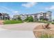 Seating area overlooking modern townhomes with shared green spaces in a community at 1918 W 165Th Way, Broomfield, CO 80023