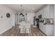 Modern kitchen featuring sleek gray cabinets, a kitchen island with seating, and stainless steel appliances at 1918 W 165Th Way, Broomfield, CO 80023